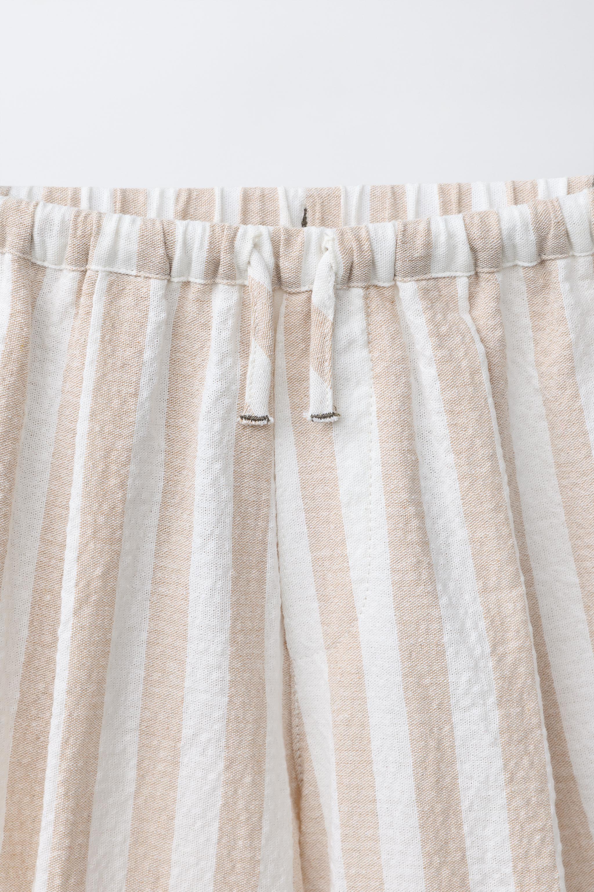 STRIPED PLEATED BALLOON PANTS